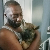 Mawo customer hugging German Shepherd puppy