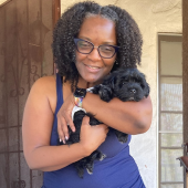 Mawoo customer hugging her newly delivered puppy